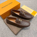 Louis Vuitton Brown Embossed Hardware Loafers — hero