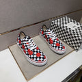 Vans Checkerboard Red Accent Sneakers — hero