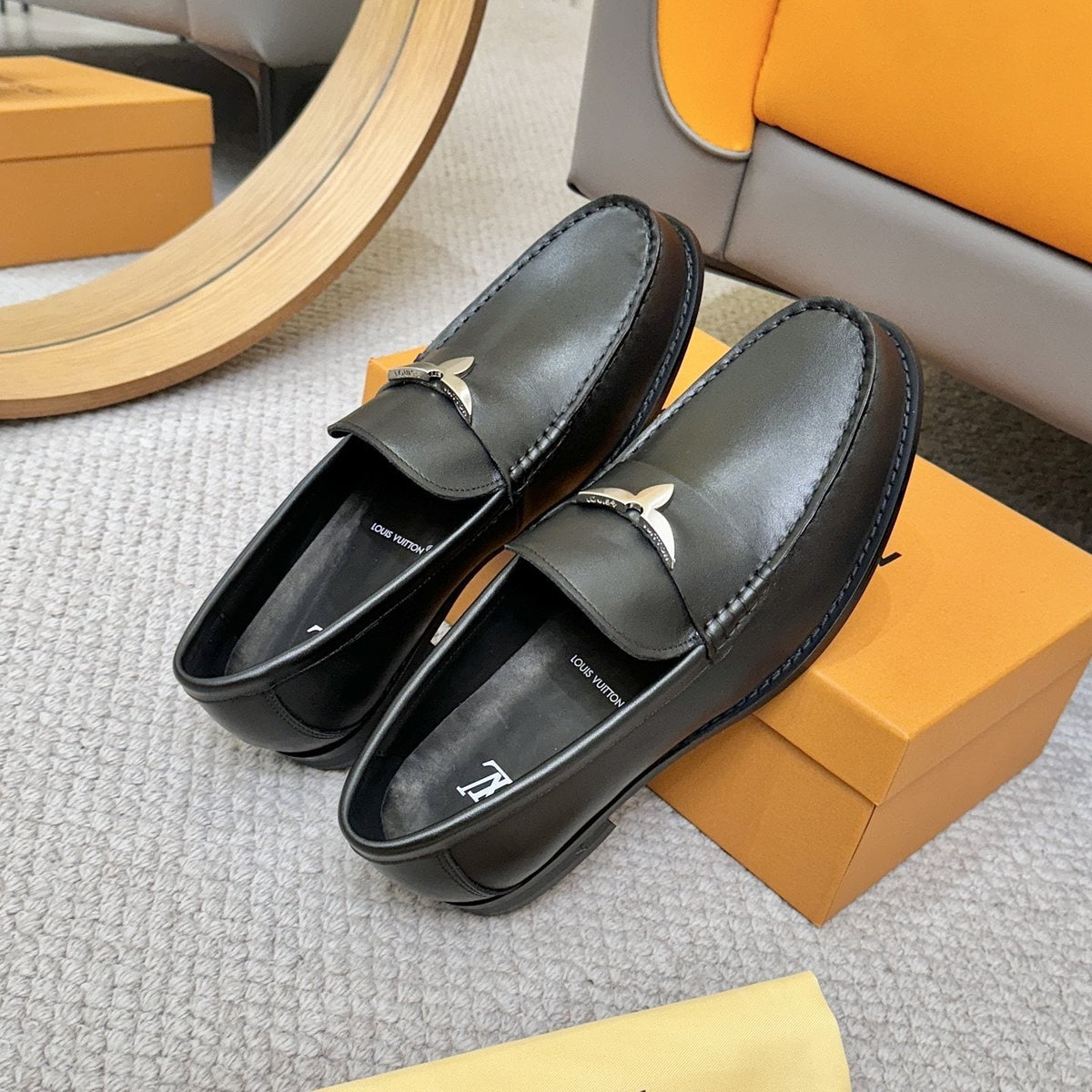 Louis Vuitton Black Metal-Accent Loafers — front