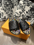 Louis Vuitton Black Embossed Slide Sandals — hero