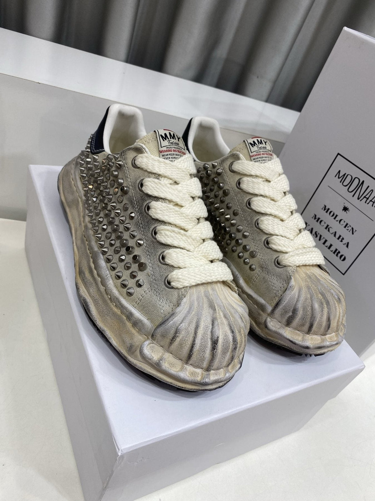 Maison Mihara Yasuhiro Distressed Studded Low-Top Sneakers — front