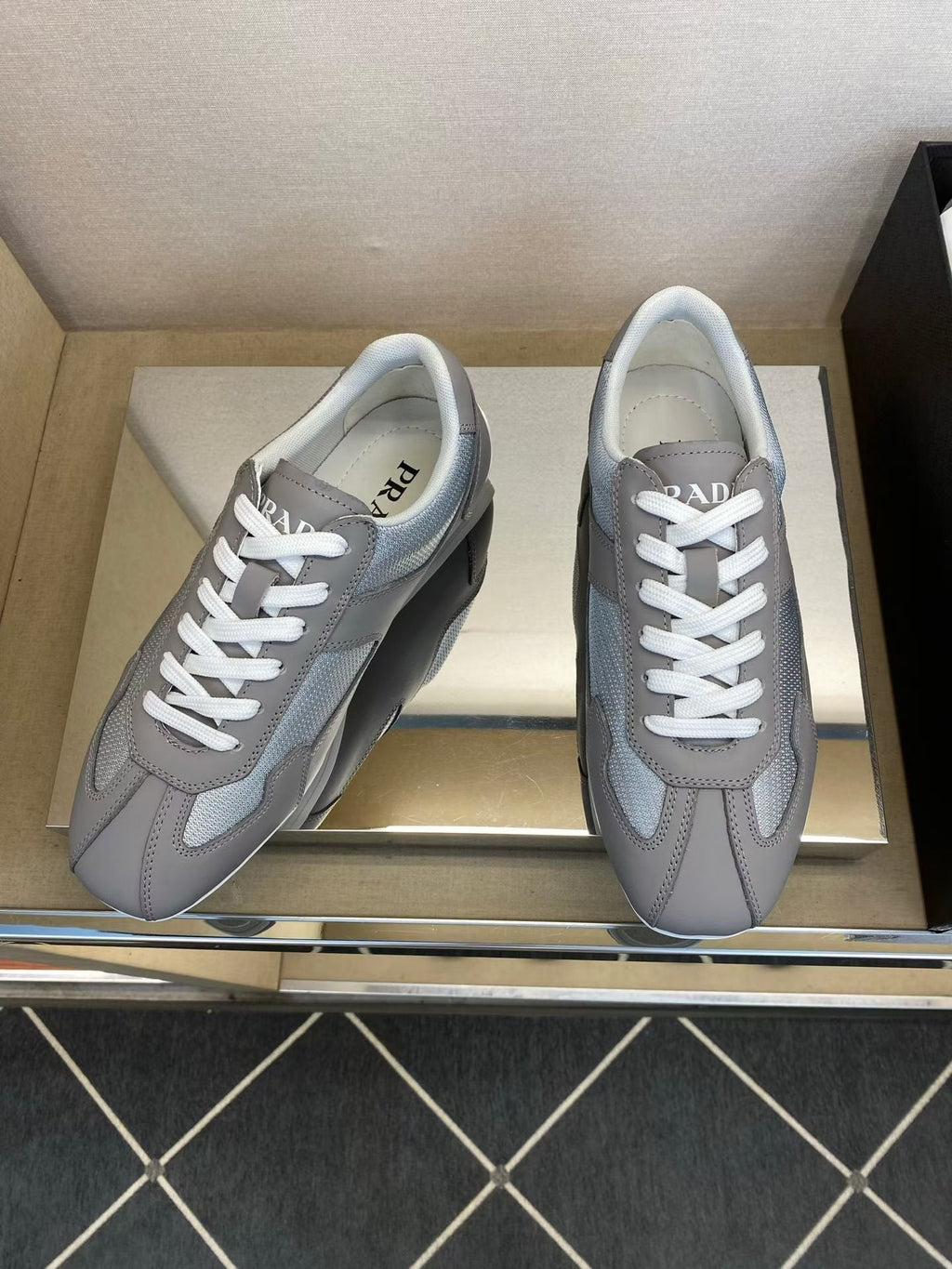 Prada Gray and White Low-Top Sneakers — hero