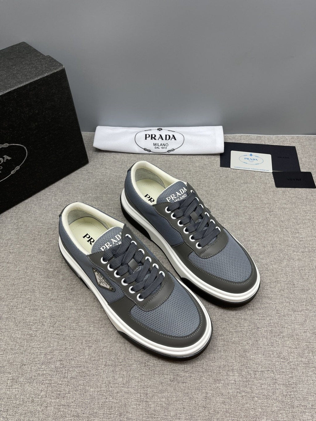 Prada Triangle Patch Low-Top Sneakers — front