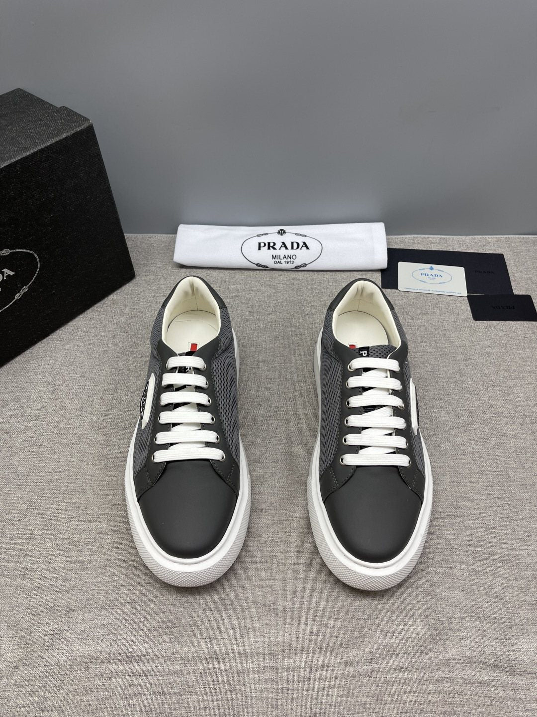 Prada Triangle Patch Low-Top Sneakers — front