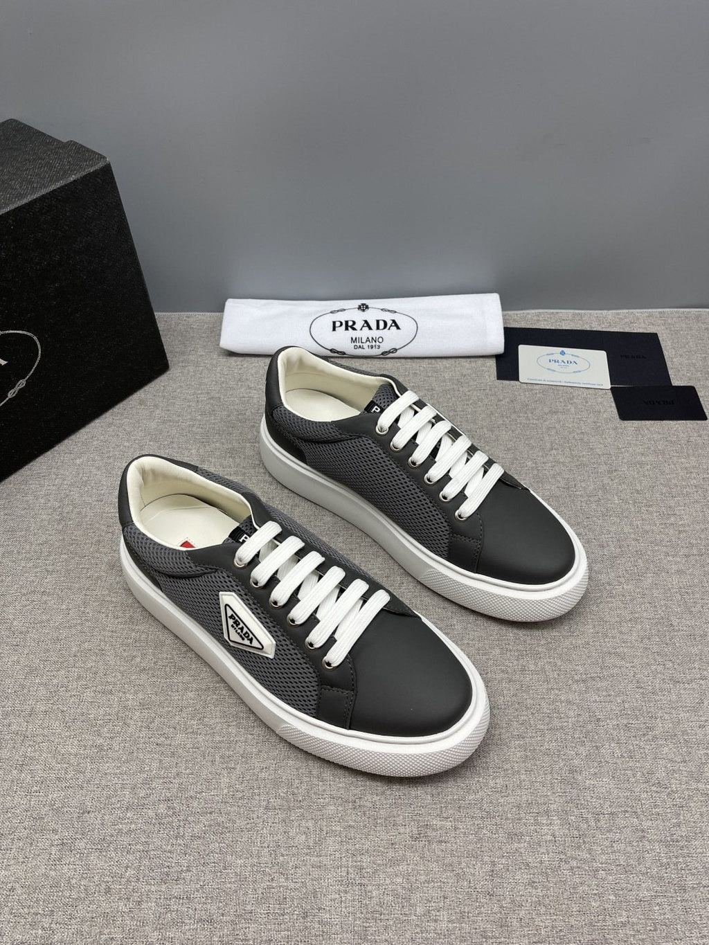 Prada Triangle Patch Low-Top Sneakers — front