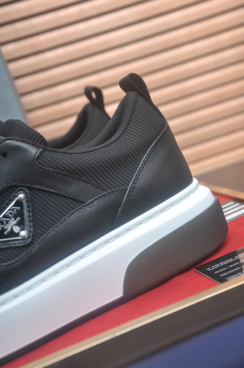 Prada Triangle Plaque Low-Top Sneakers — detail