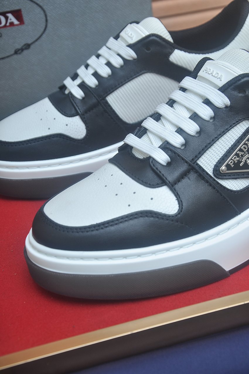 Prada Triangle Plaque Low-Top Sneakers — detail