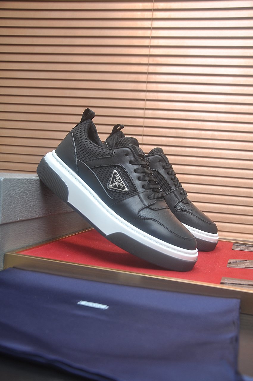 Prada Triangle Plaque Low-Top Sneakers — hero