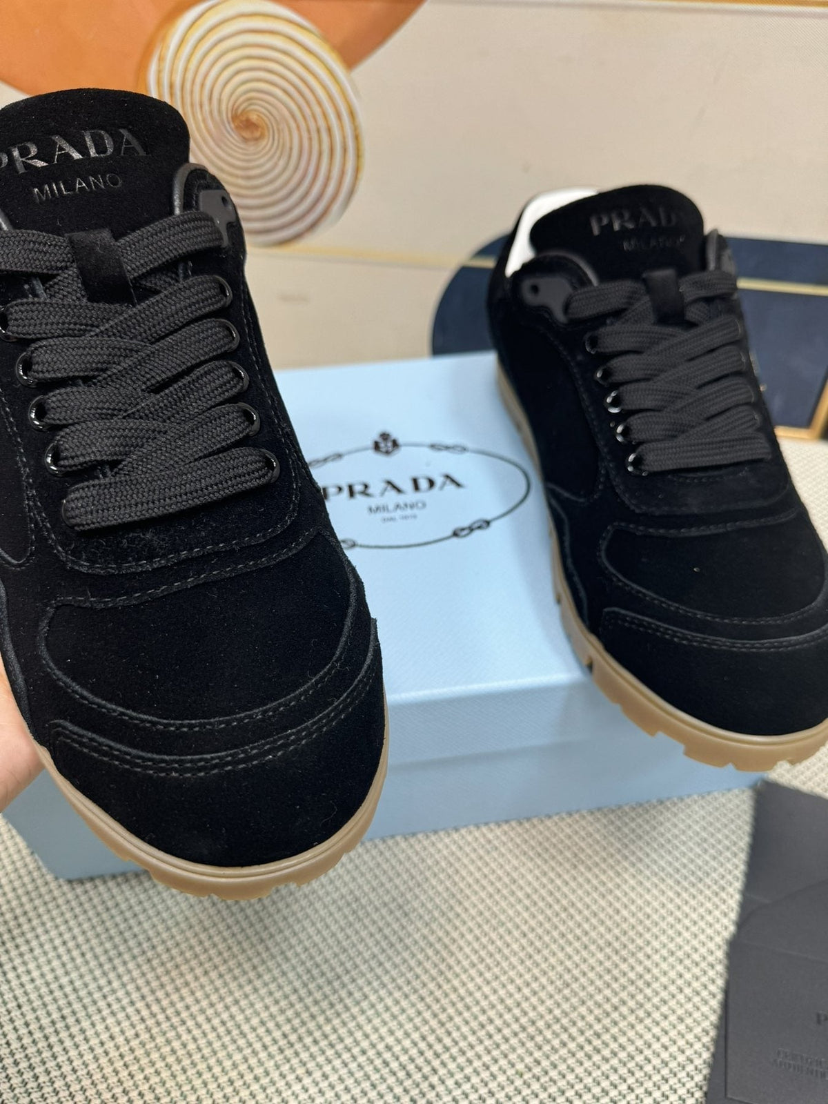 Prada Triangle Logo Low-Top Sneakers — model