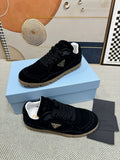 Prada Triangle Logo Low-Top Sneakers — hero