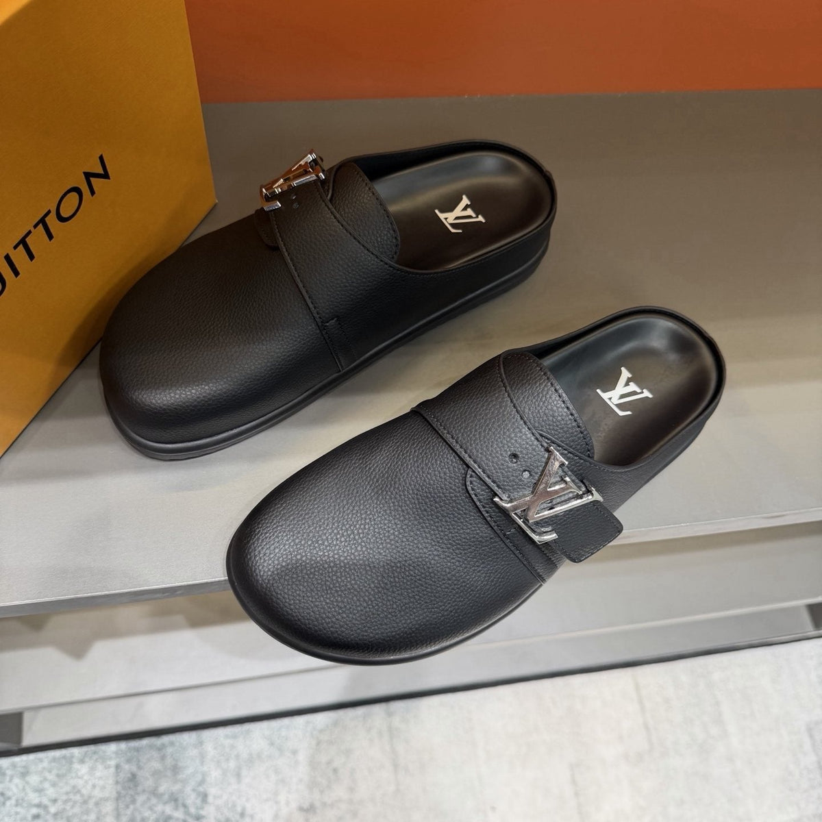 Louis Vuitton Textured Buckle Slide Sandals — front