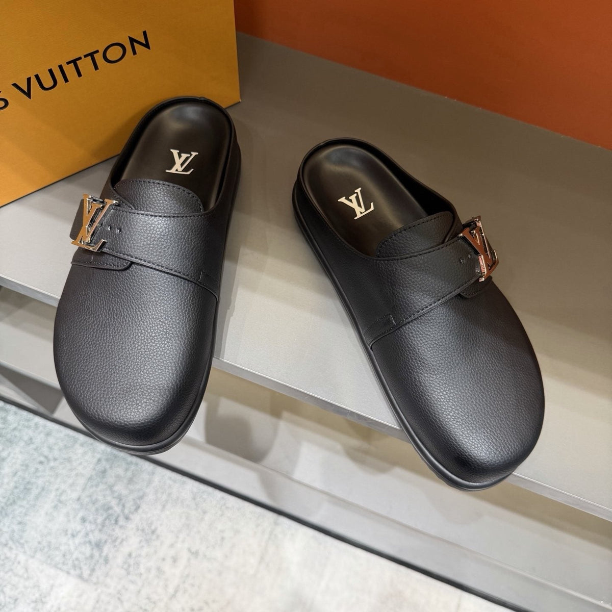 Louis Vuitton Textured Buckle Slide Sandals — front