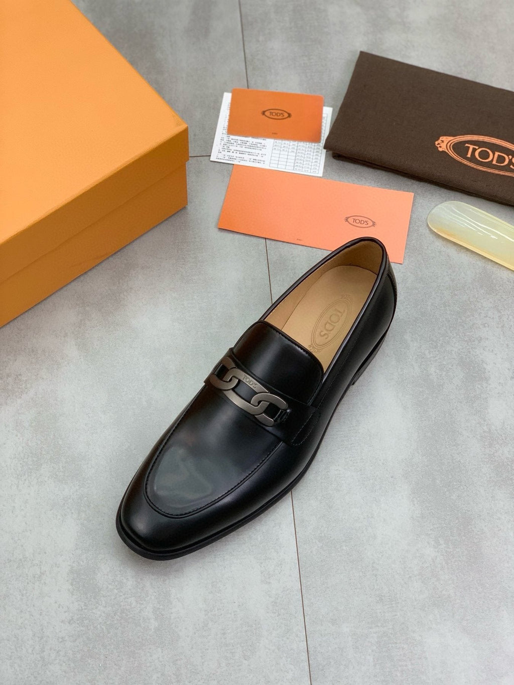 TOD'S Black Metal-Accent Loafers — front