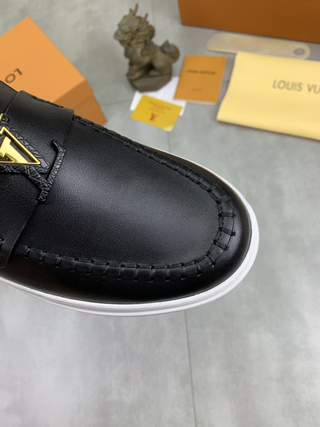 Louis Vuitton Metal Emblem Slip-On Loafers — detail