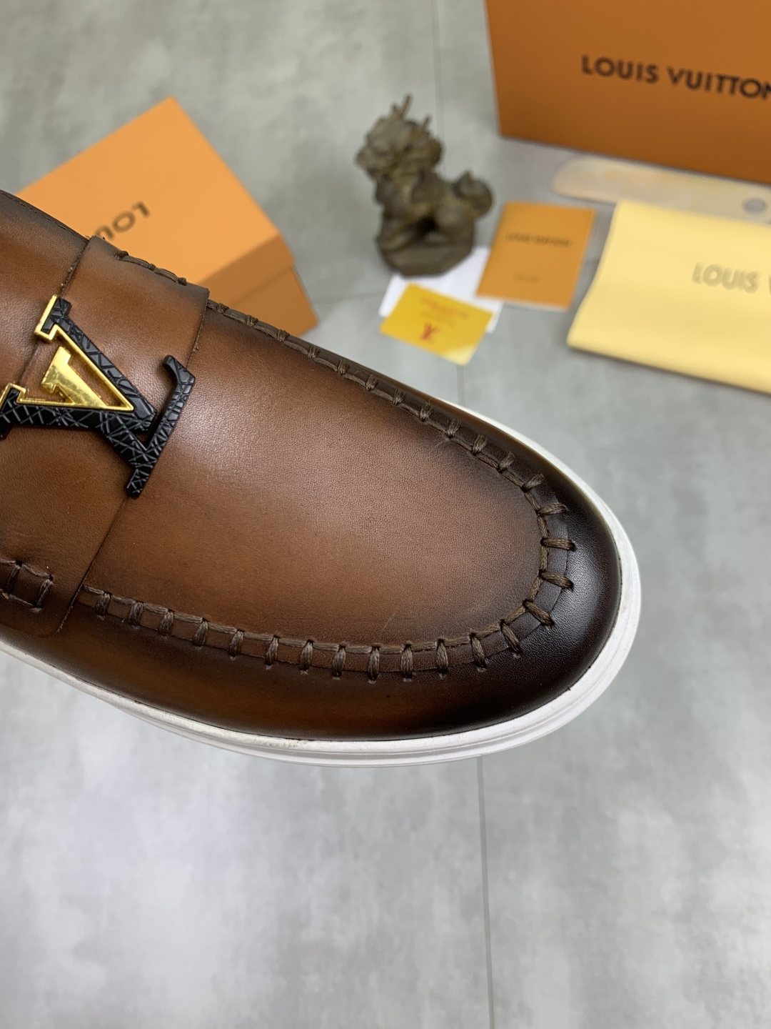 Louis Vuitton Metal Emblem Slip-On Loafers — detail