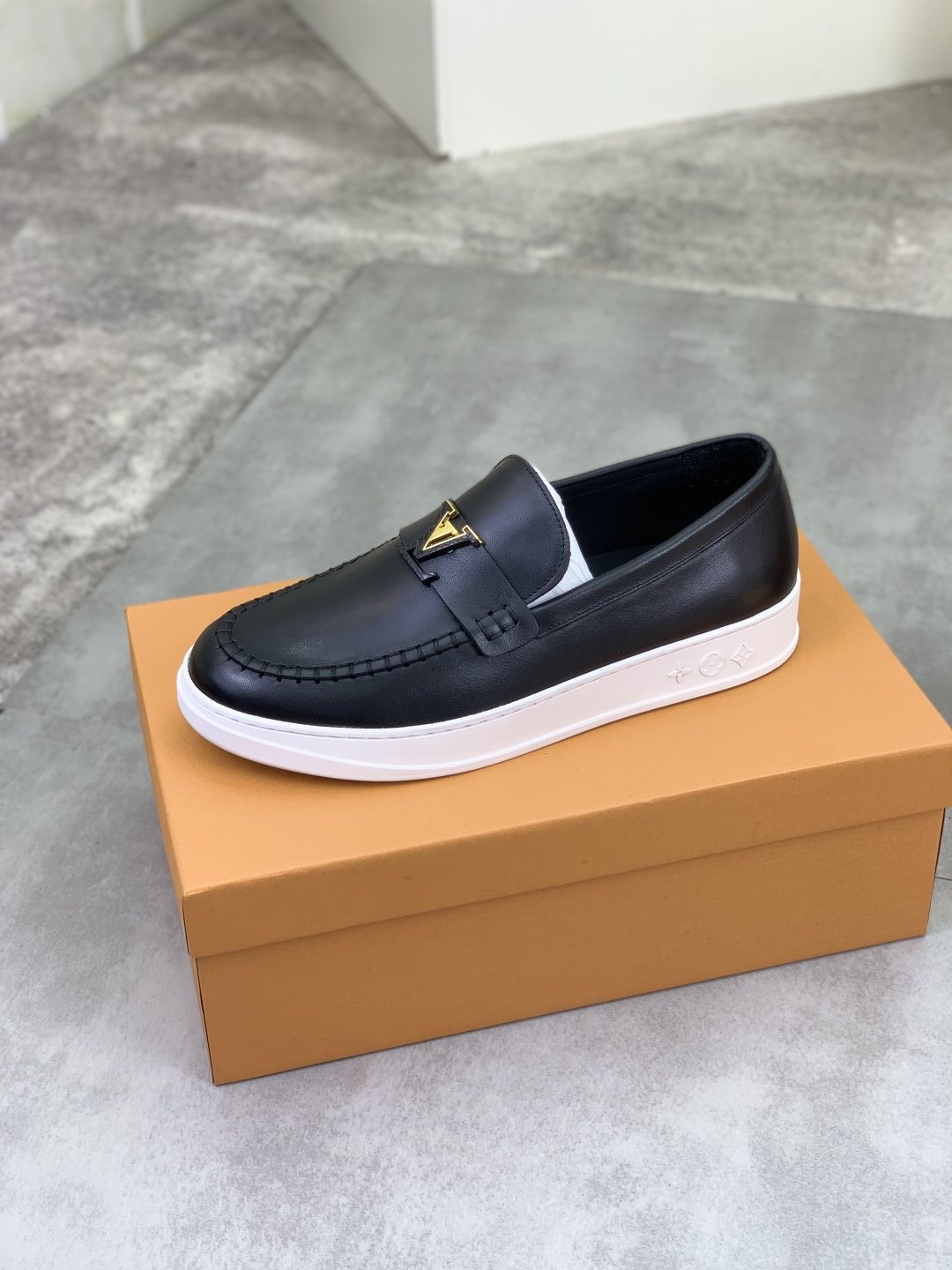 Louis Vuitton Metal Emblem Slip-On Loafers — front