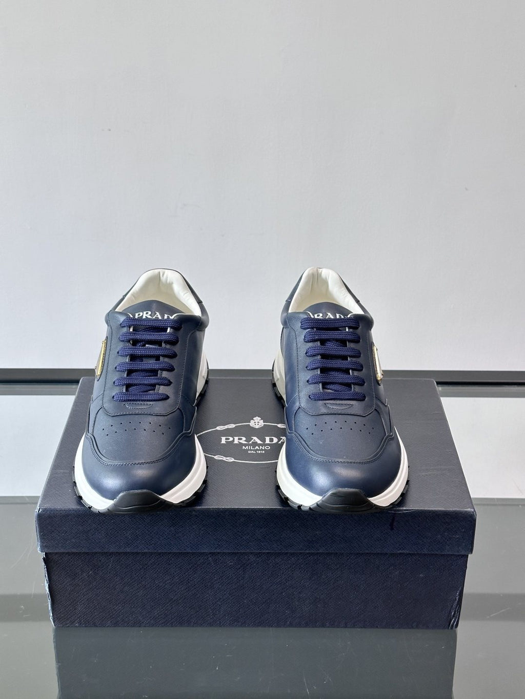 Prada Triangle Plaque Low-Top Sneakers — front