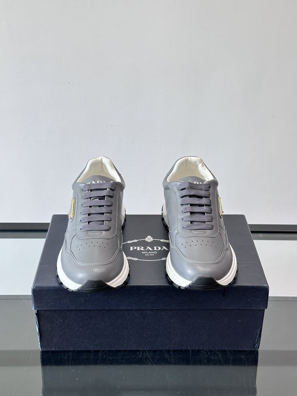 Prada Triangle Plaque Low-Top Sneakers — front