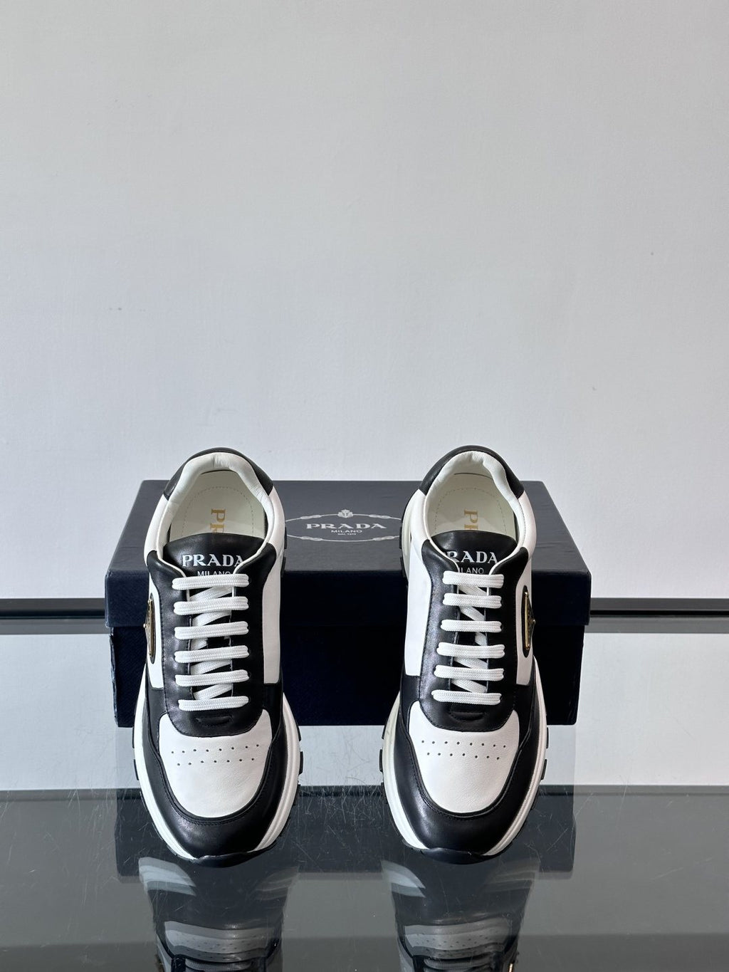 Prada Triangle Plaque Low-Top Sneakers — front