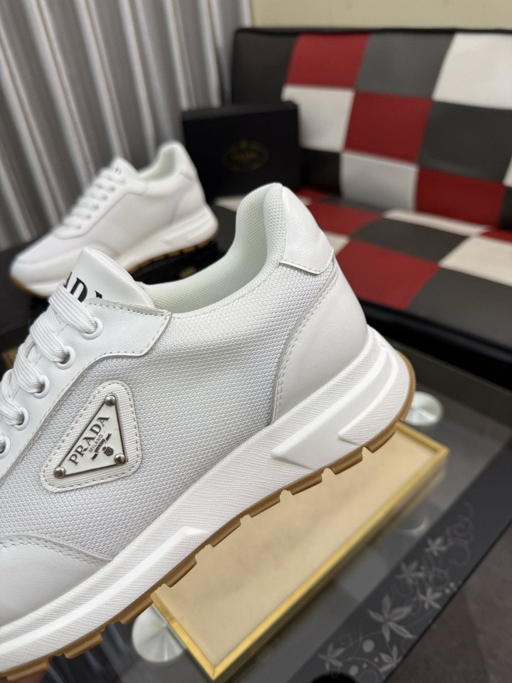 Prada Triangle Plaque Low-Top Sneakers — detail