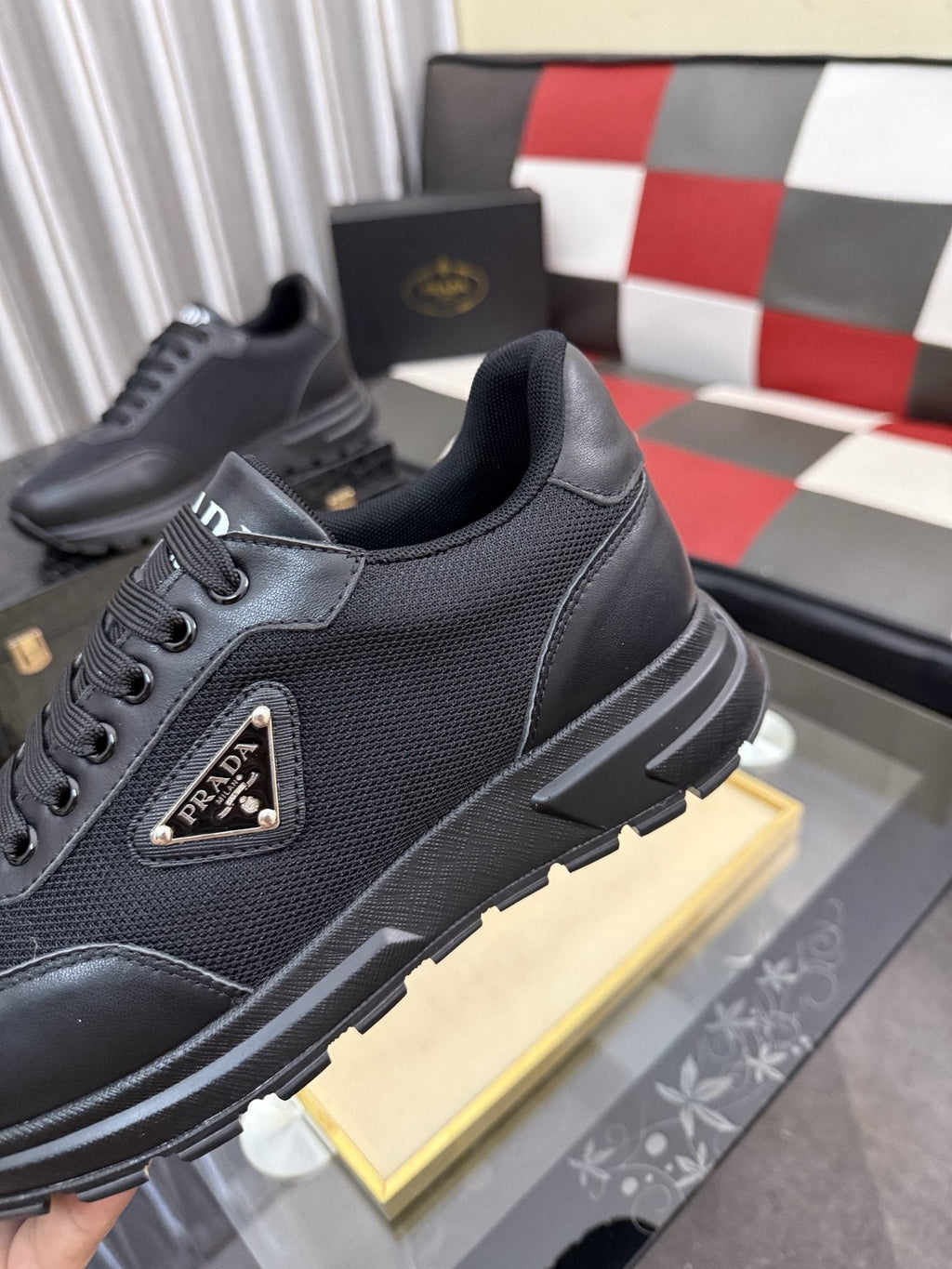 Prada Triangle Plaque Low-Top Sneakers — hero