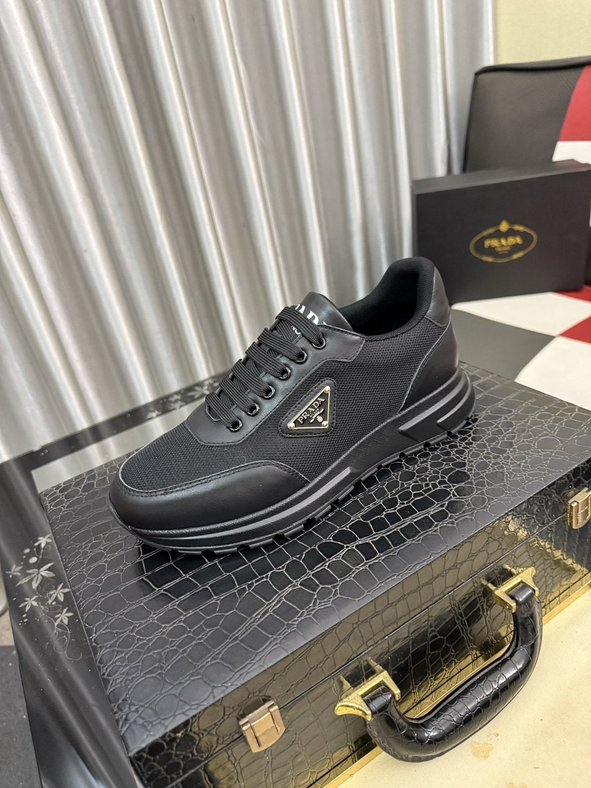 Prada Triangle Plaque Low-Top Sneakers — front