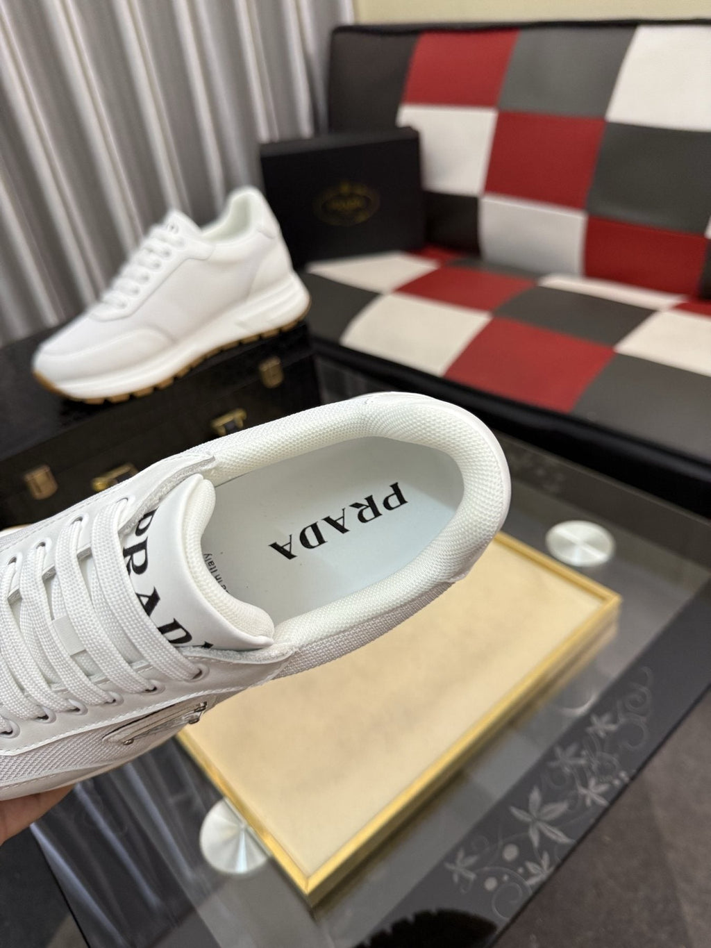 Prada Triangle Plaque Low-Top Sneakers — detail