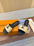Louis Vuitton Textured Logo Slide Sandals — front