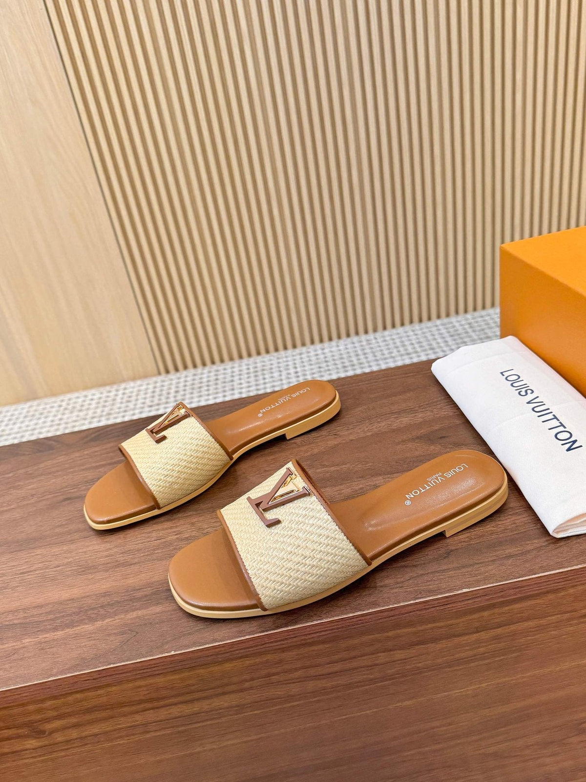 Louis Vuitton Textured Logo Slide Sandals — front