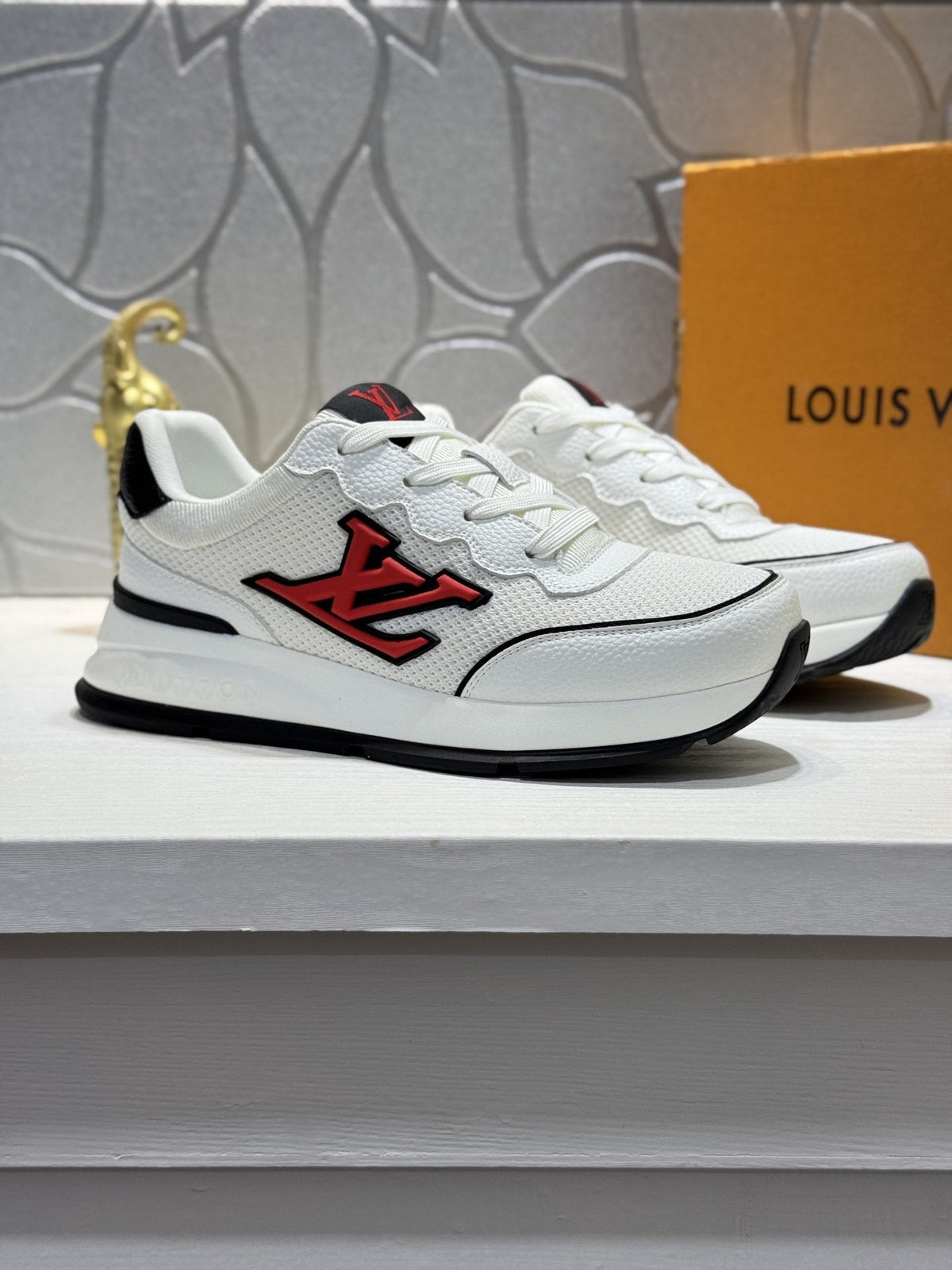 Louis Vuitton Low-Top Logo Sneakers — hero