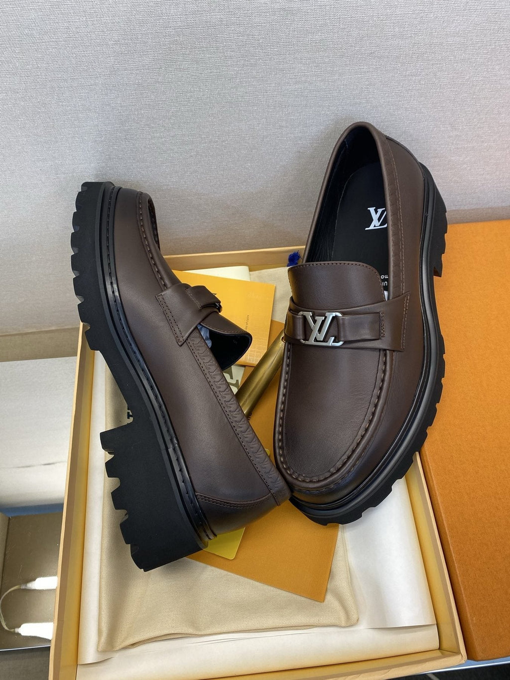 Louis Vuitton Metal Logo Loafers — front