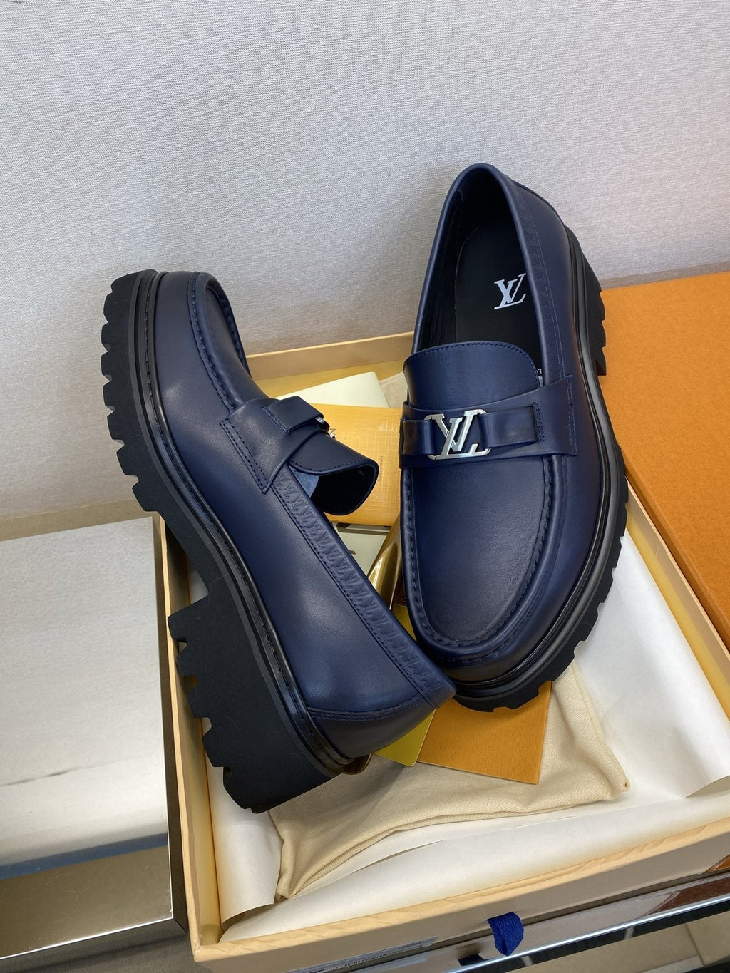 Louis Vuitton Metal Logo Loafers — front