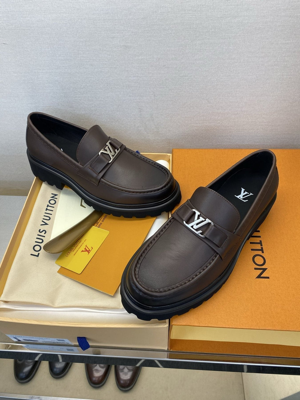 Louis Vuitton Metal Logo Loafers — front