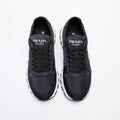 PRADA Navy Triangle Badge Sneakers — hero