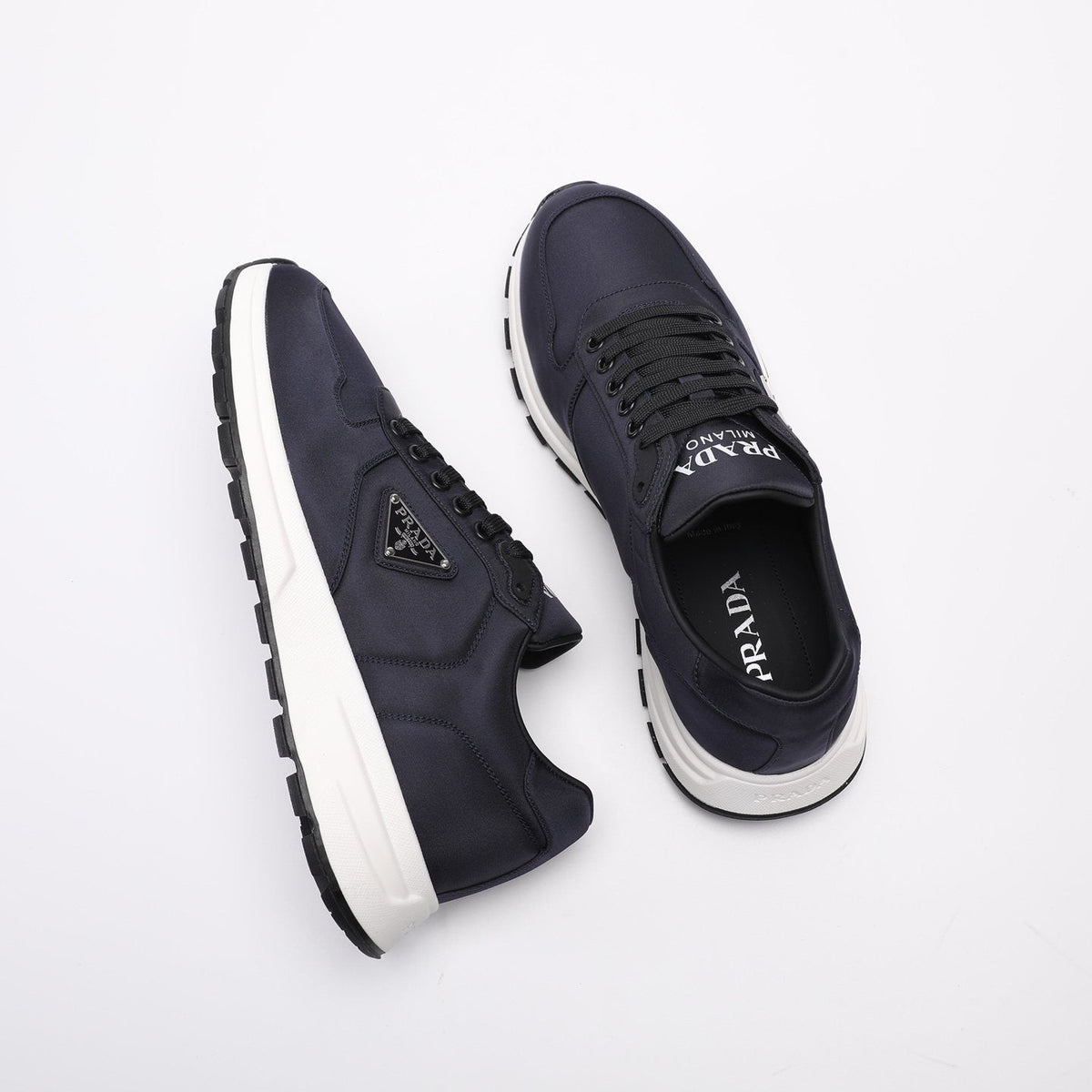 PRADA Navy Triangle Badge Sneakers — front
