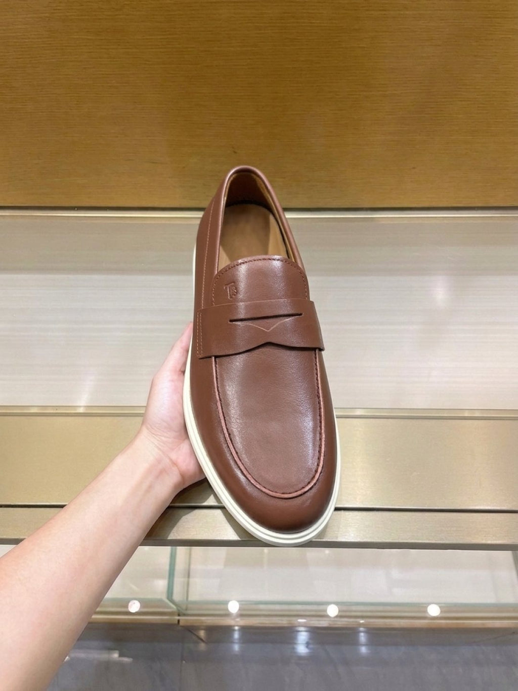 Tod's Brown Penny Loafers — model
