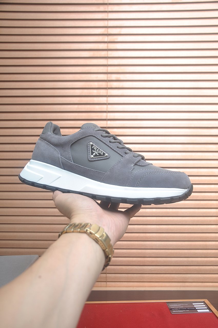 Prada Triangle Plaque Low-Top Sneakers — front