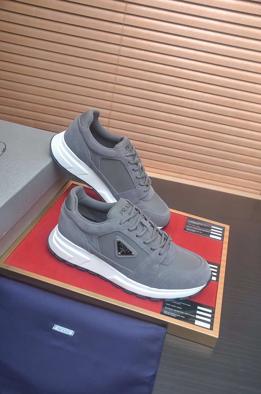 Prada Triangle Plaque Low-Top Sneakers — front