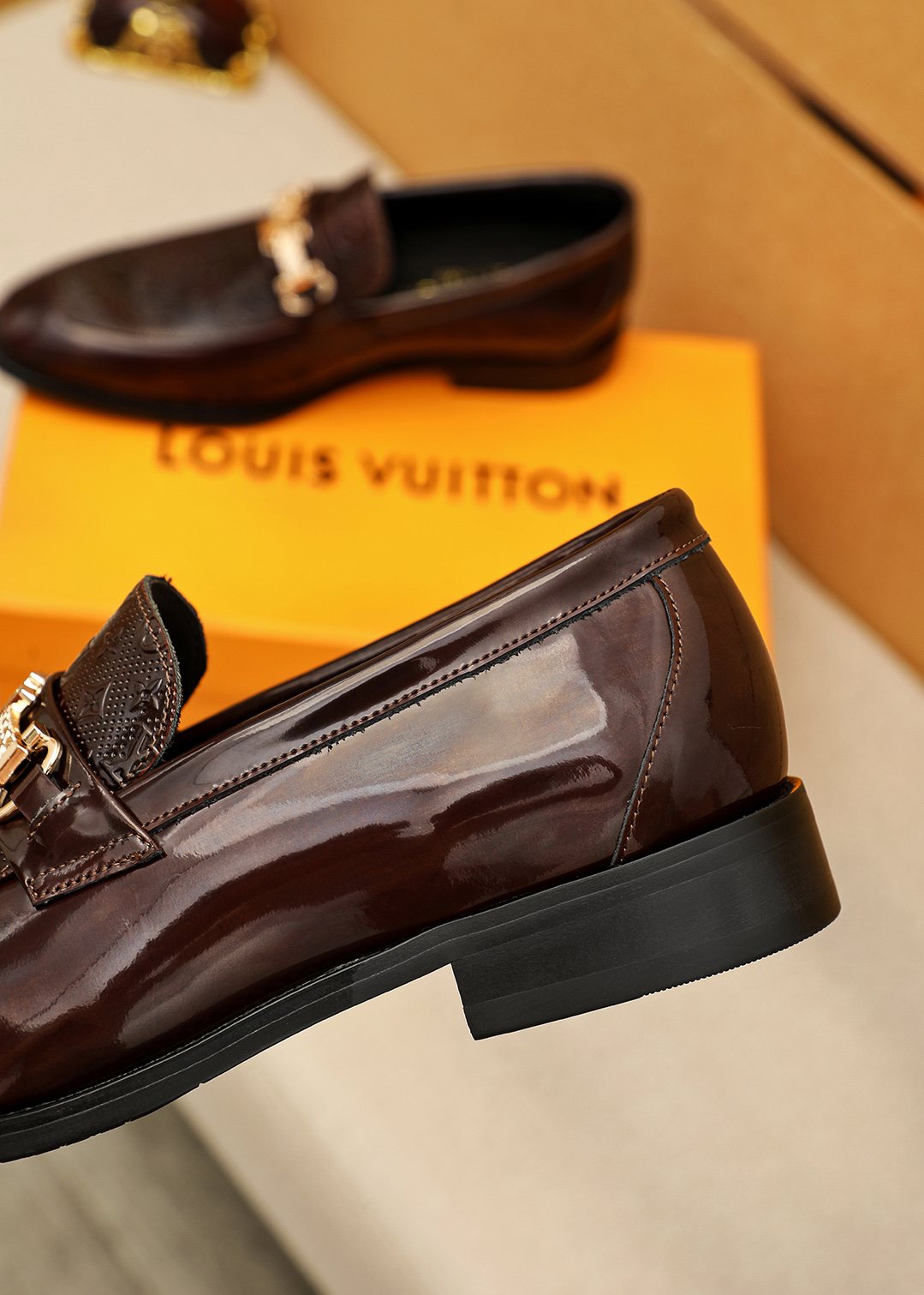 Louis Vuitton Embossed Buckle Loafers — back