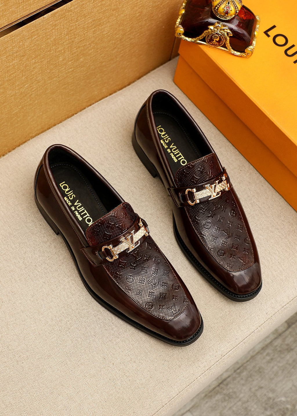 Louis Vuitton Embossed Buckle Loafers — front