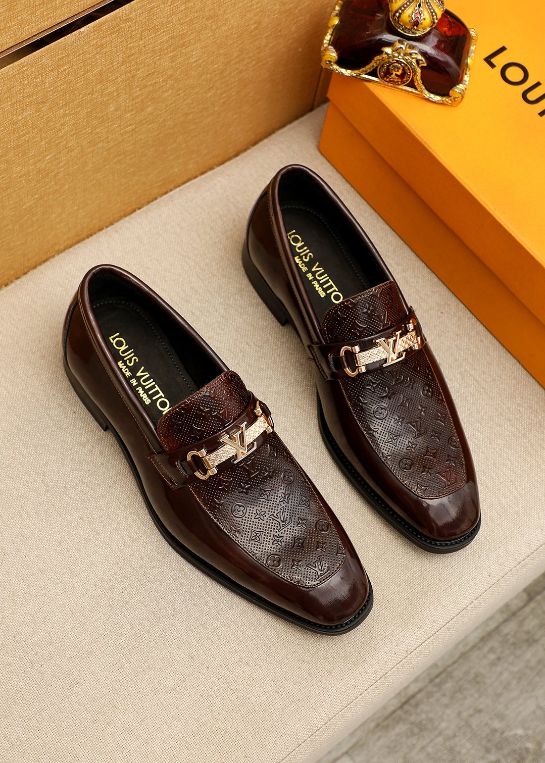 Louis Vuitton Embossed Buckle Loafers — front
