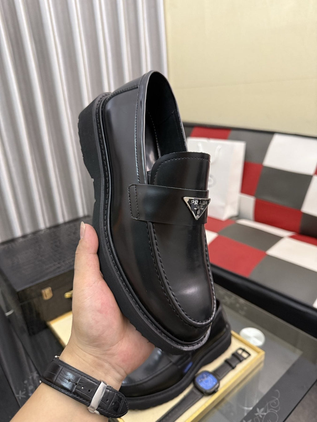 Prada Triangle Plaque Loafers — model
