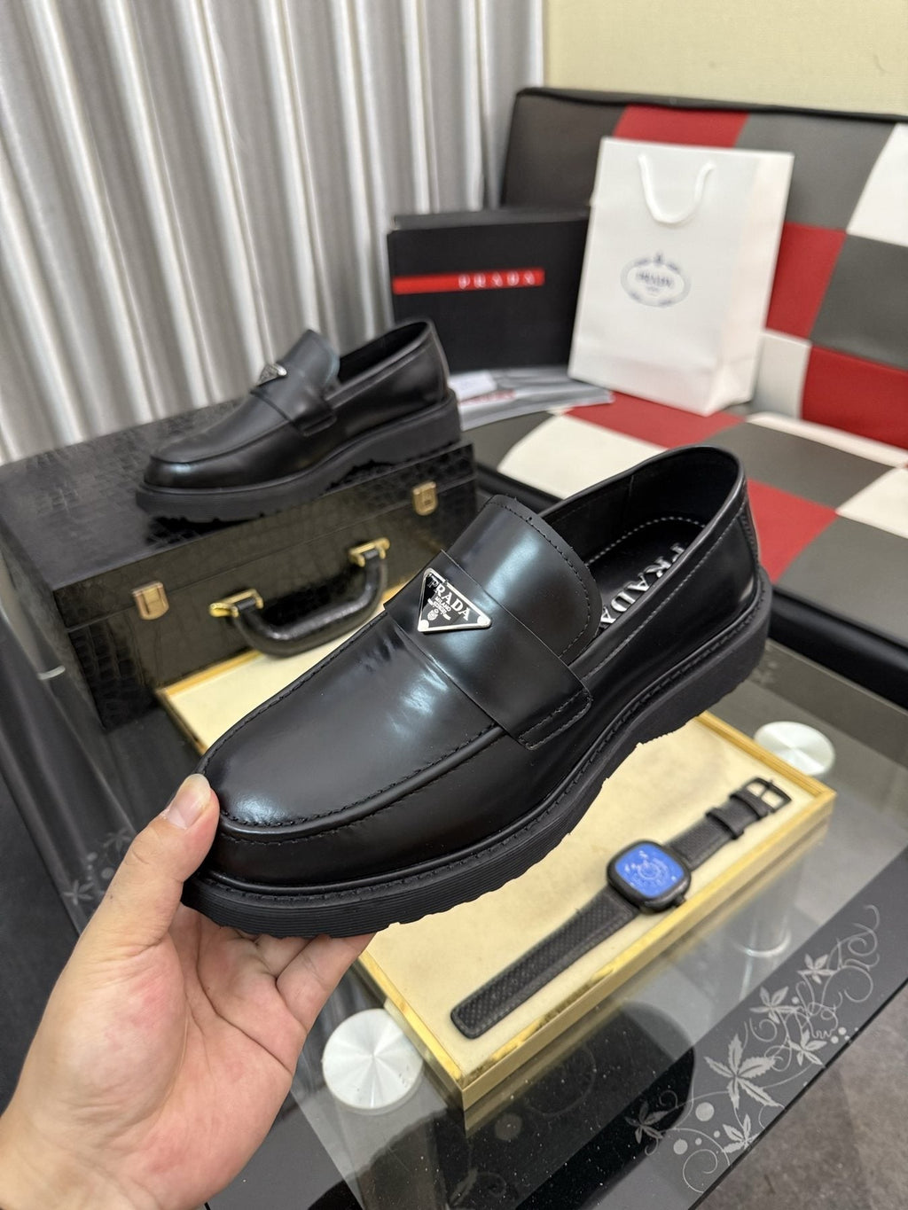 Prada Triangle Plaque Loafers — model