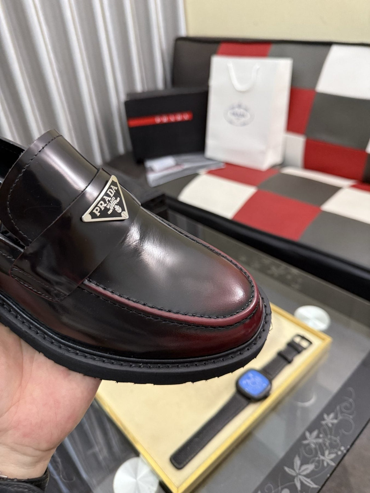 Prada Triangle Plaque Loafers — detail