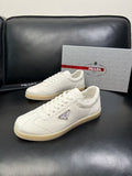 Prada Triangle Logo Low-Top Sneakers — hero