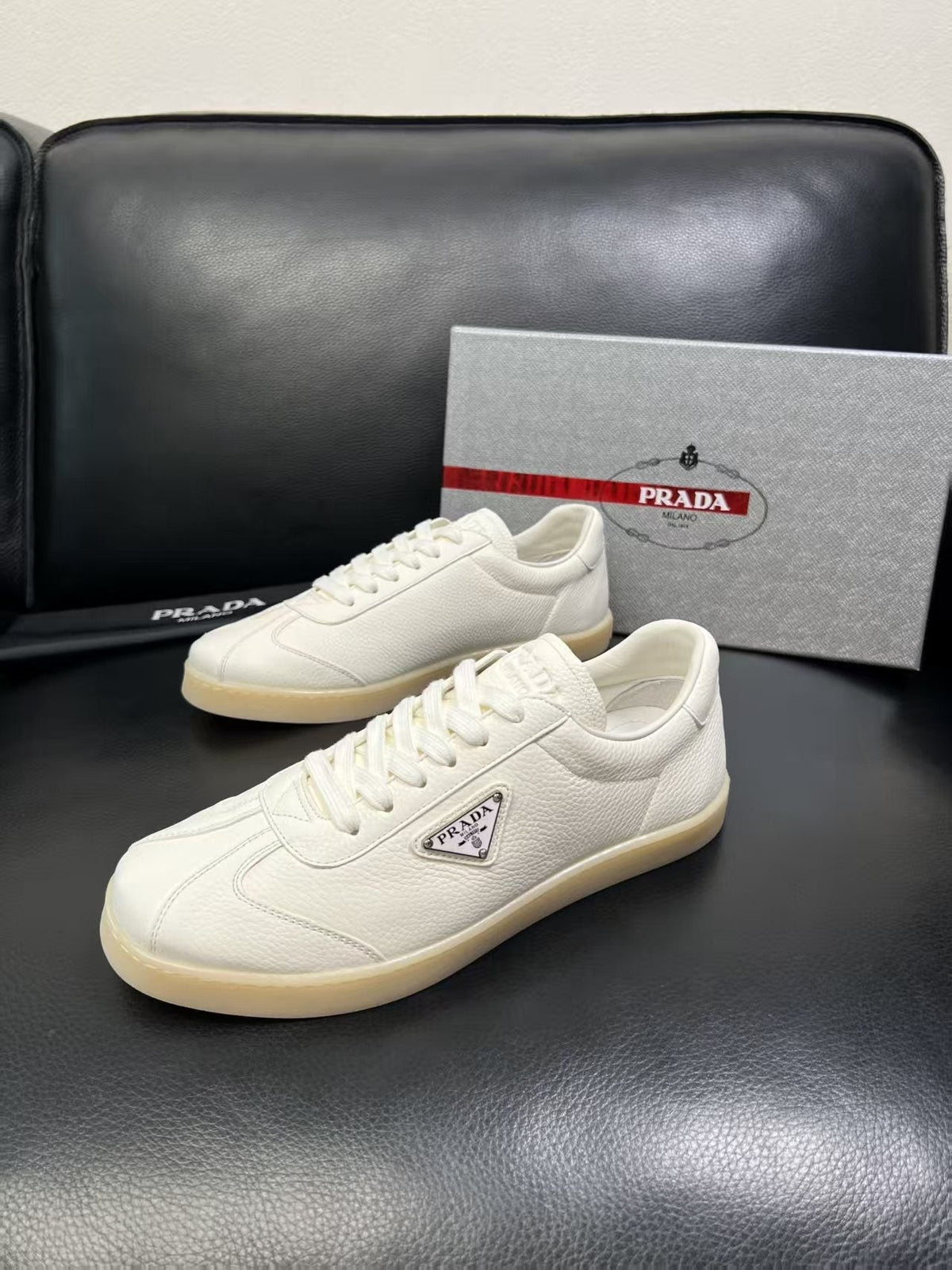 Prada Triangle Logo Low-Top Sneakers — hero