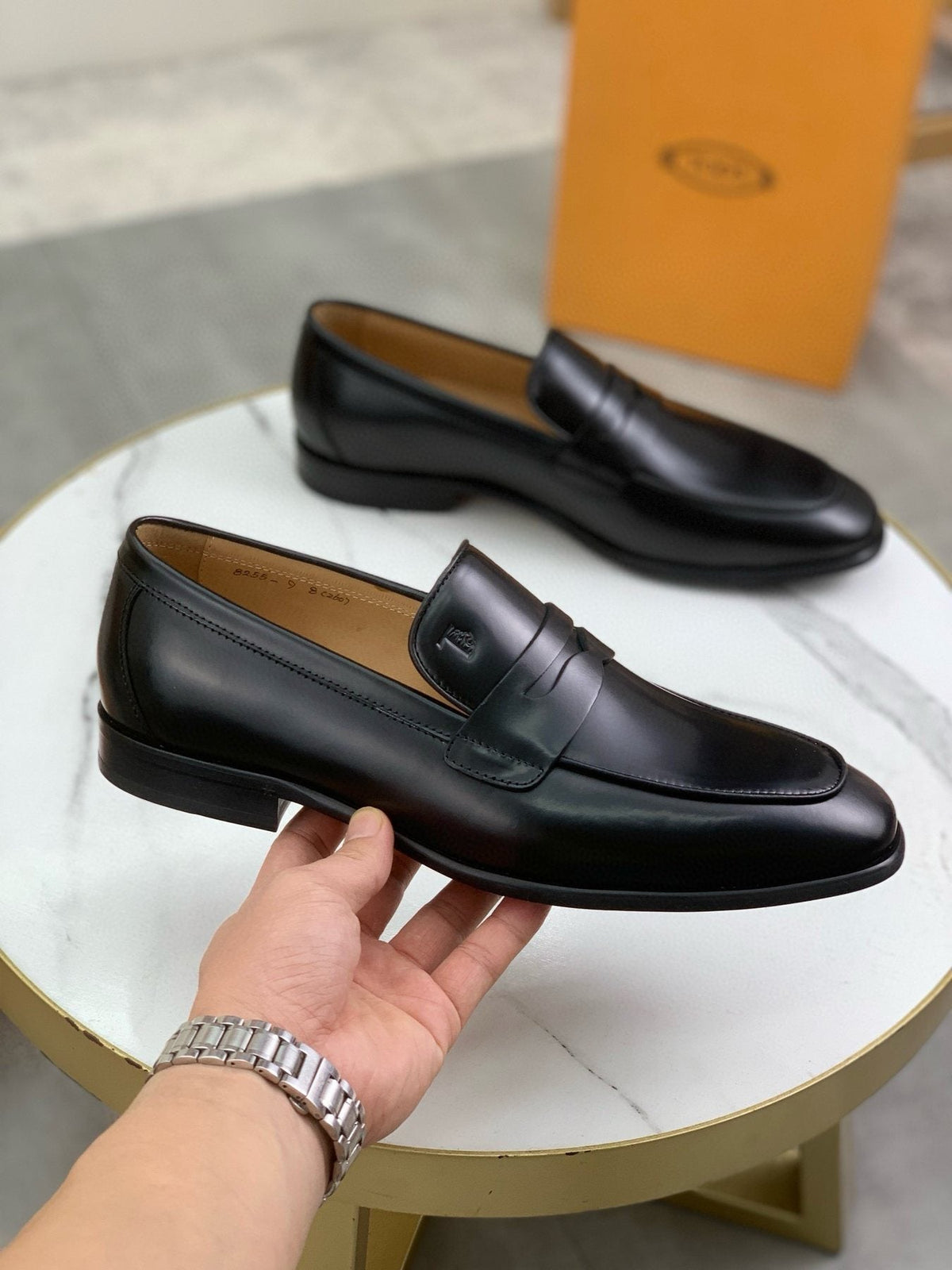 Tod's Black Penny Loafers — model