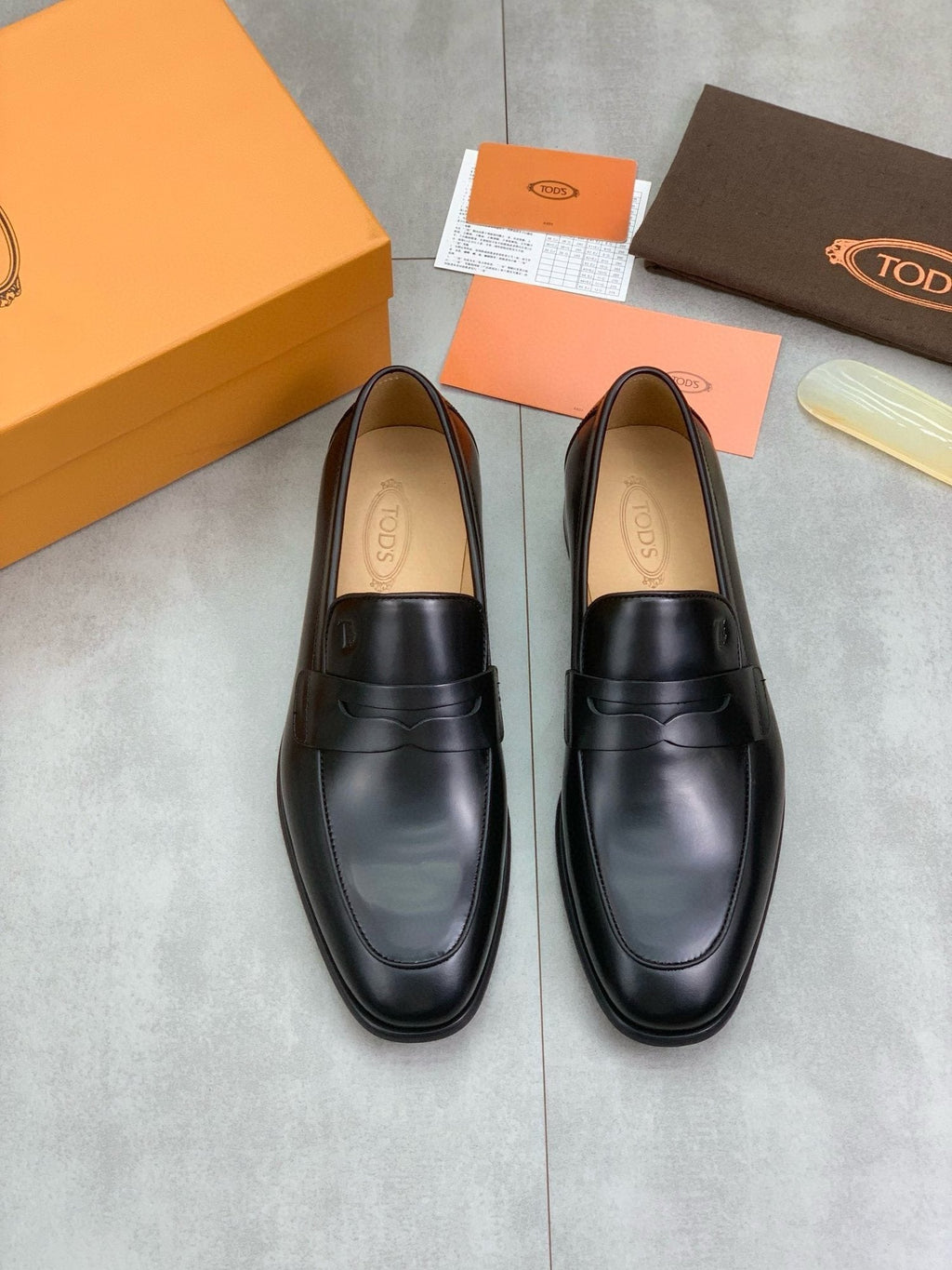Tod's Black Penny Loafers — hero