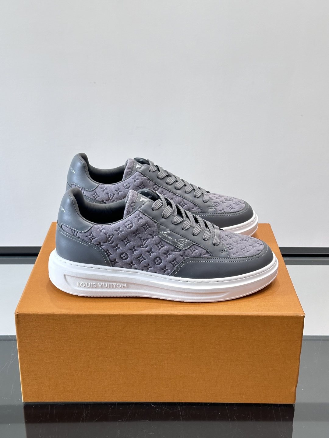 Louis Vuitton Embossed Low-Top Sneakers — front