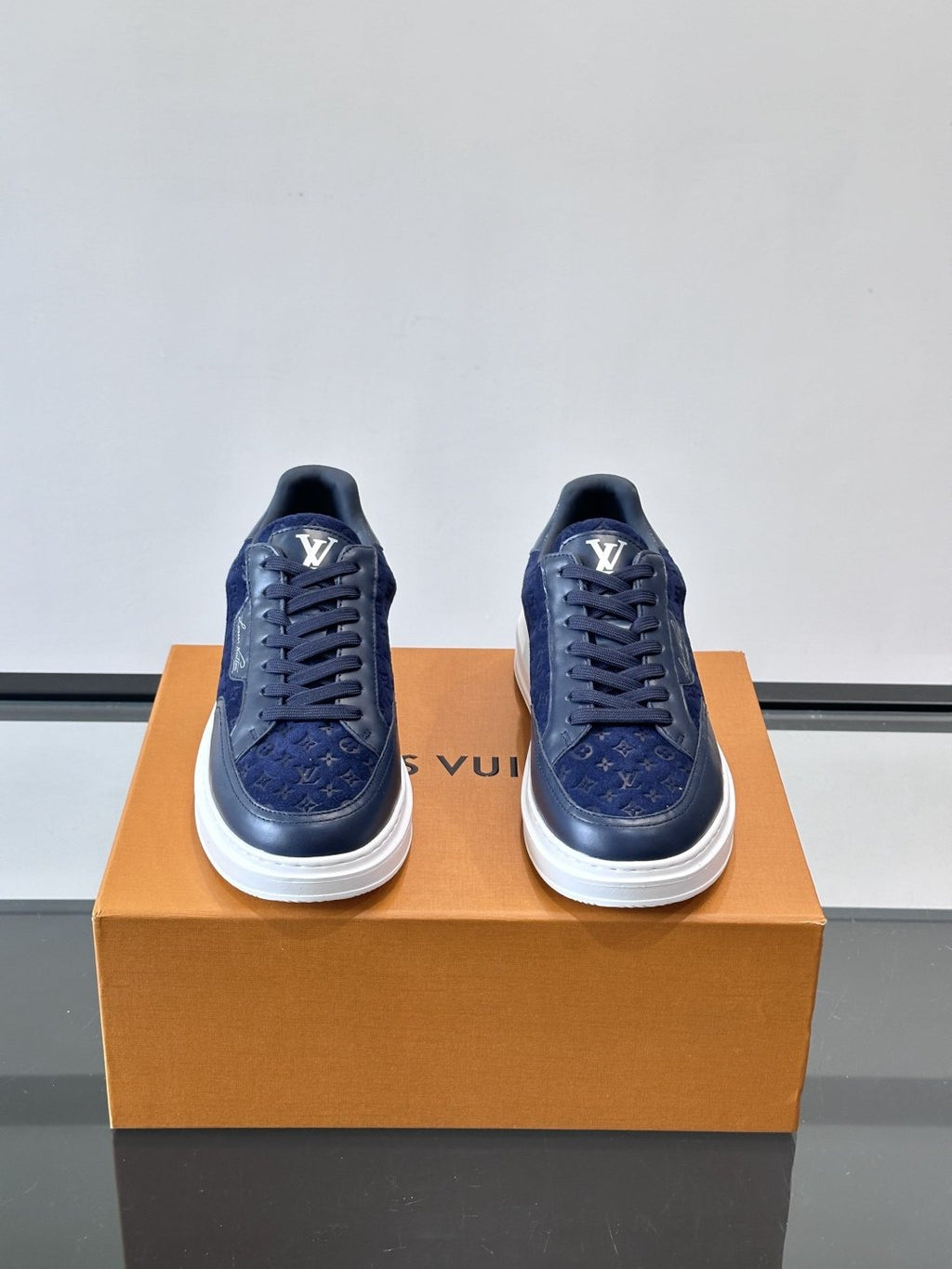 Louis Vuitton Embossed Low-Top Sneakers — front